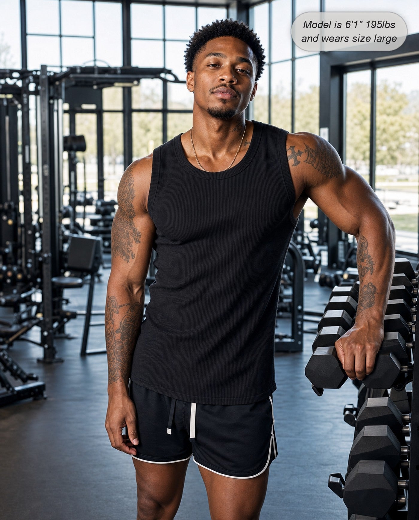 Man wearing the Apex fitted ribbed tank in black at the gym