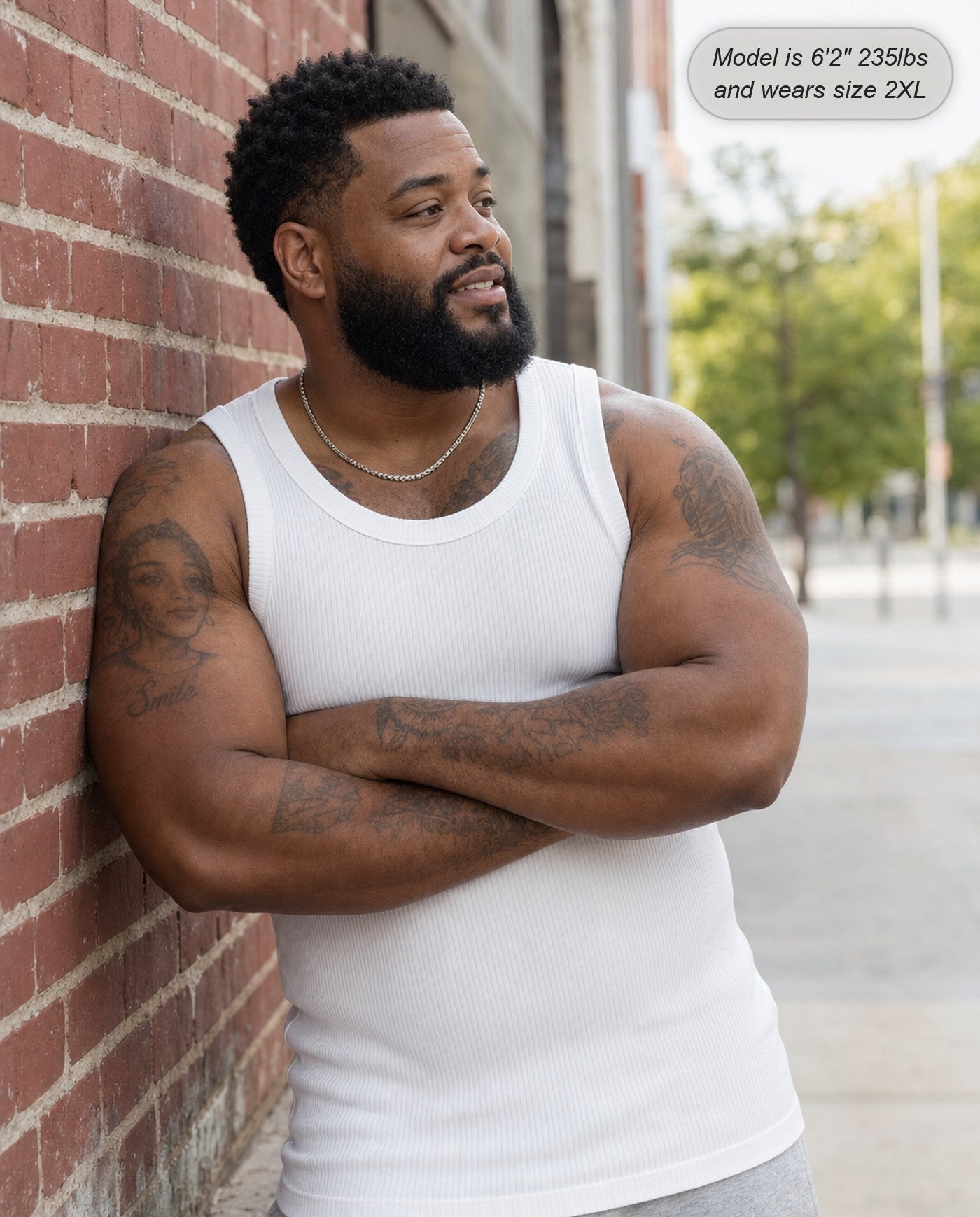 Man wearing the Apex ribbed tank in white on the street