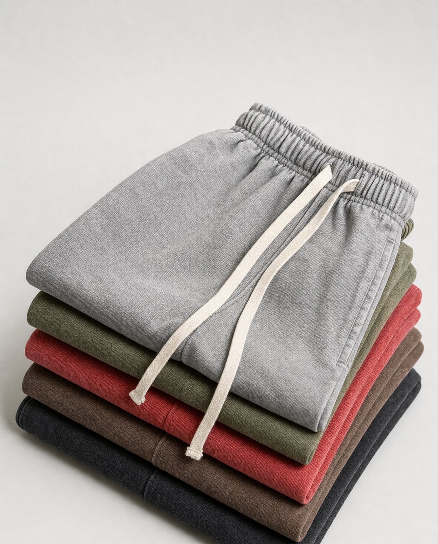 Colossus baggy acid wash shorts folded stack in five colourways