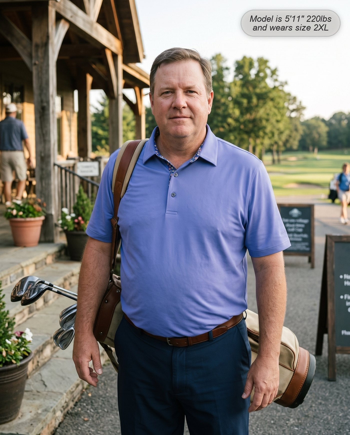 Man wearing the Meridian golf polo in periwinkle outside the pro shop