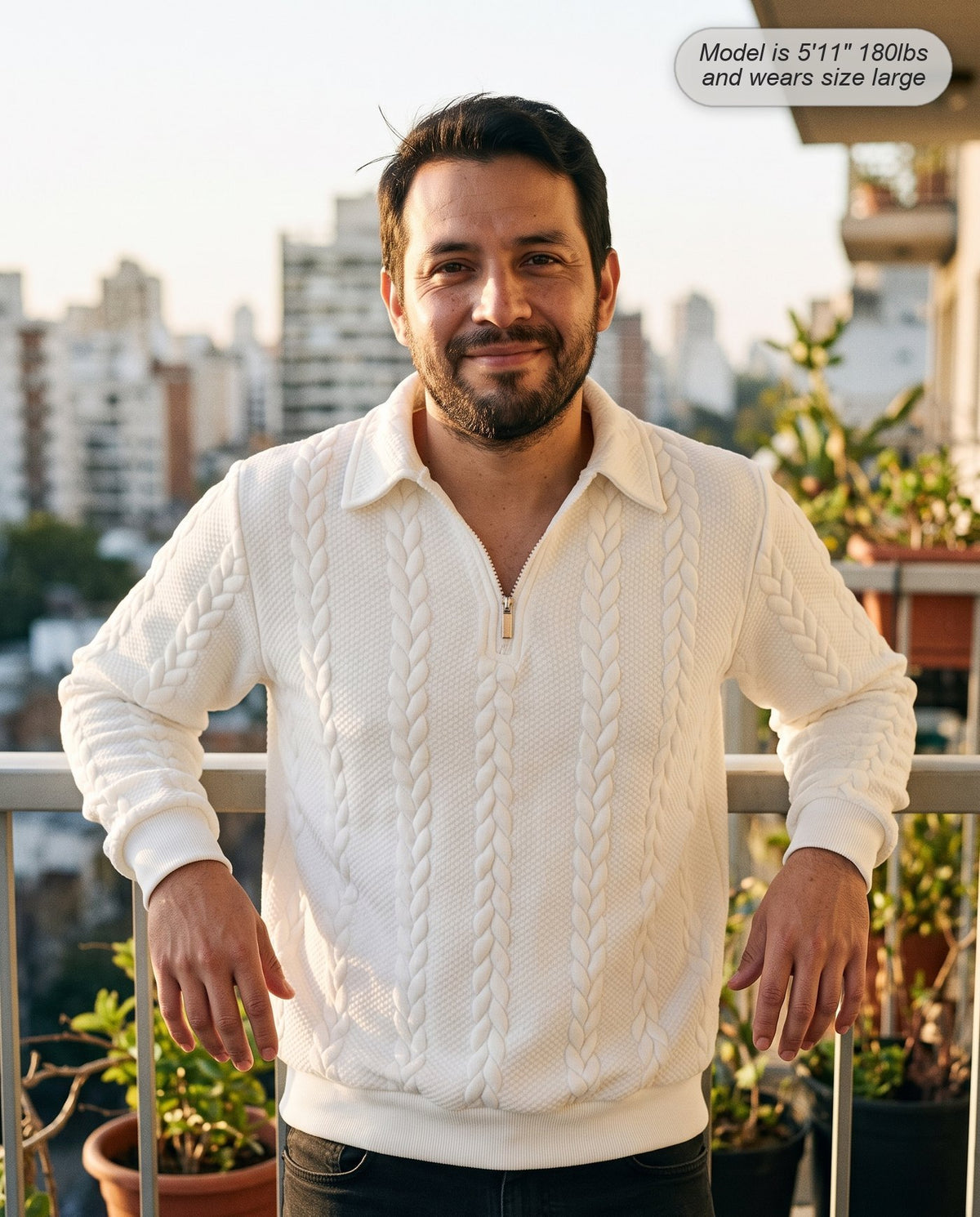 Man wearing the Regent quarter zip knit in ivory on a balcony