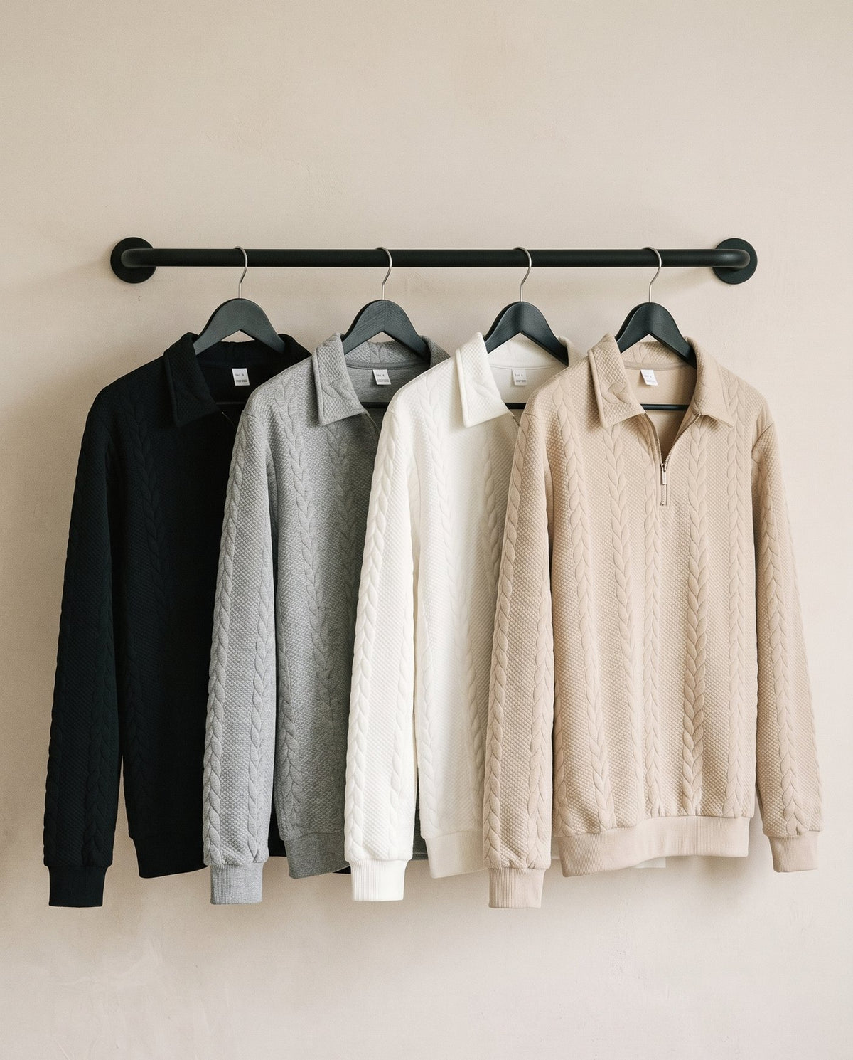 Regent quarter zip knits hanging in all four colourways