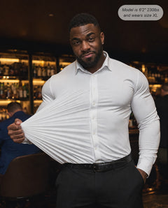 Sovereign stretch dress shirt in white, four-way stretch demonstration in a bar