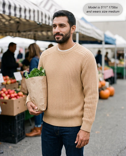 Man wearing the Admiral relaxed ribbed knit sweater in beige at a farmers market