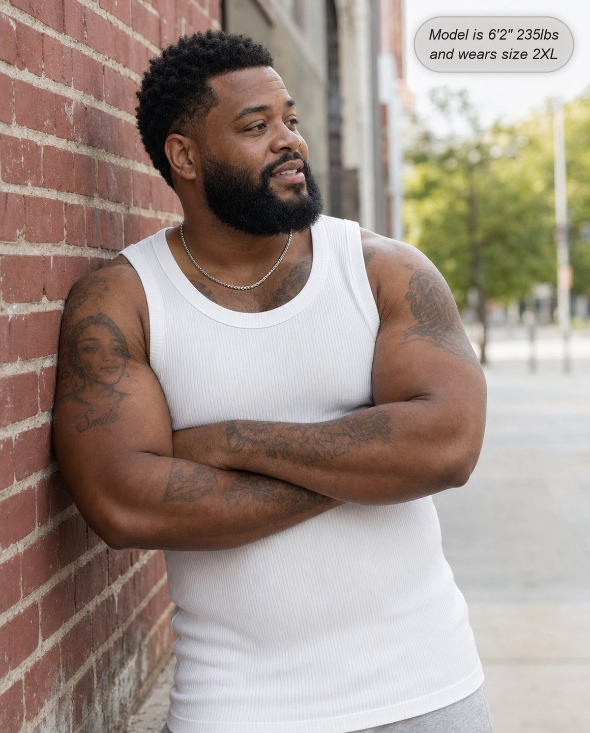 Man wearing the Apex ribbed tank in white on the street