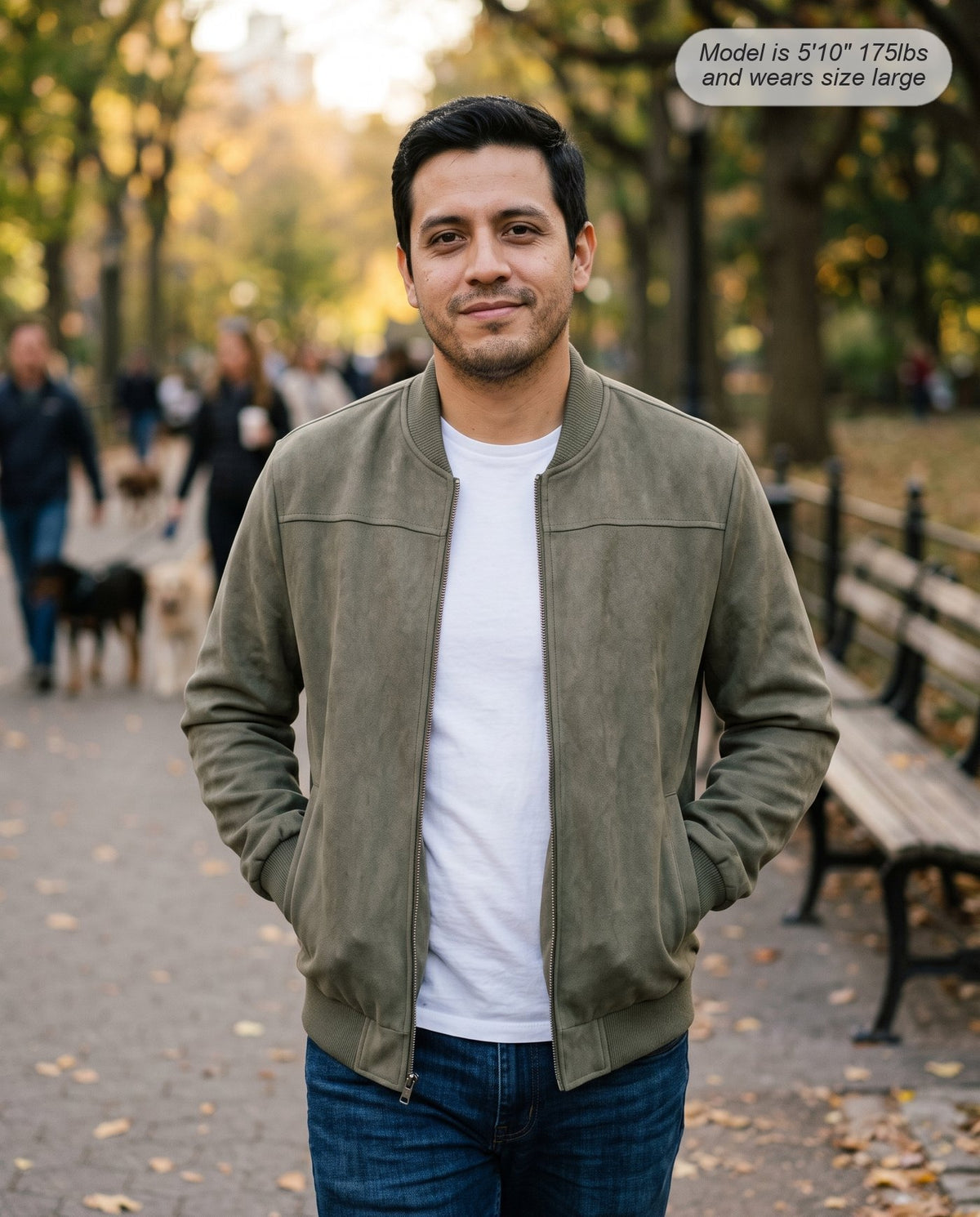 Man wearing the Atlas suede bomber jacket in dusty olive in a park