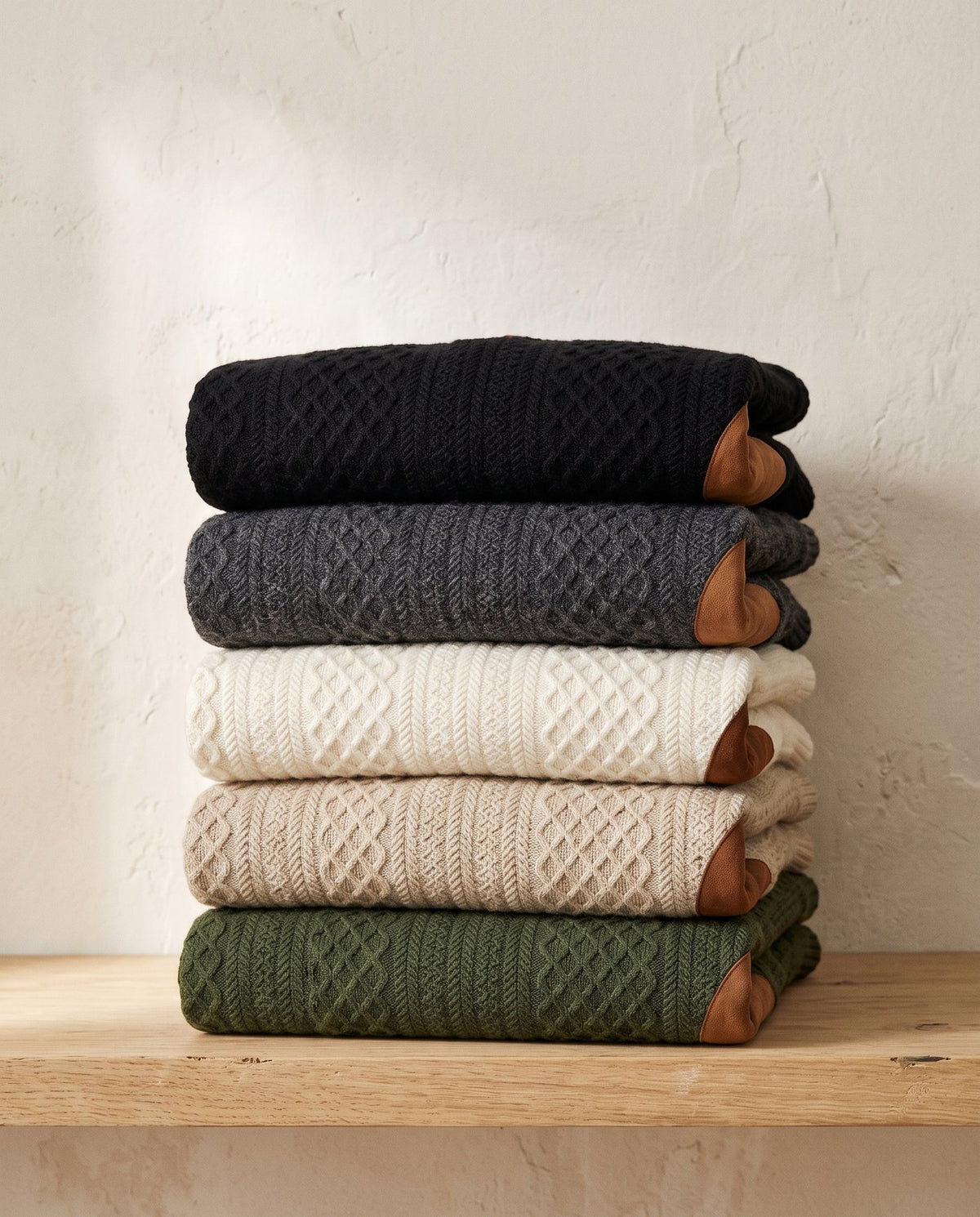 Bastion jacquard sweaters stacked in all five colourways