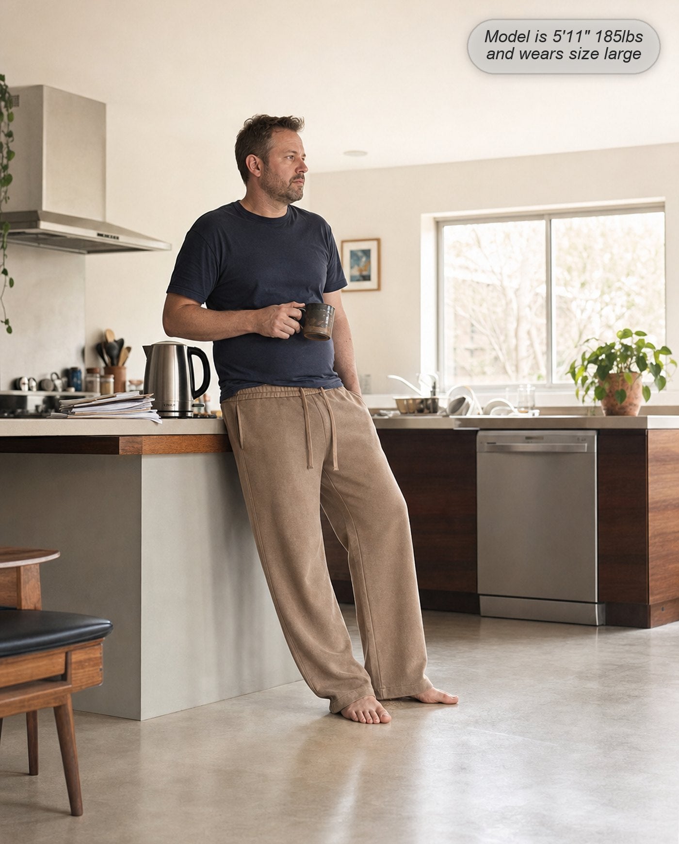 Man wearing Citadel sweatpants in washed camel at home in the kitchen