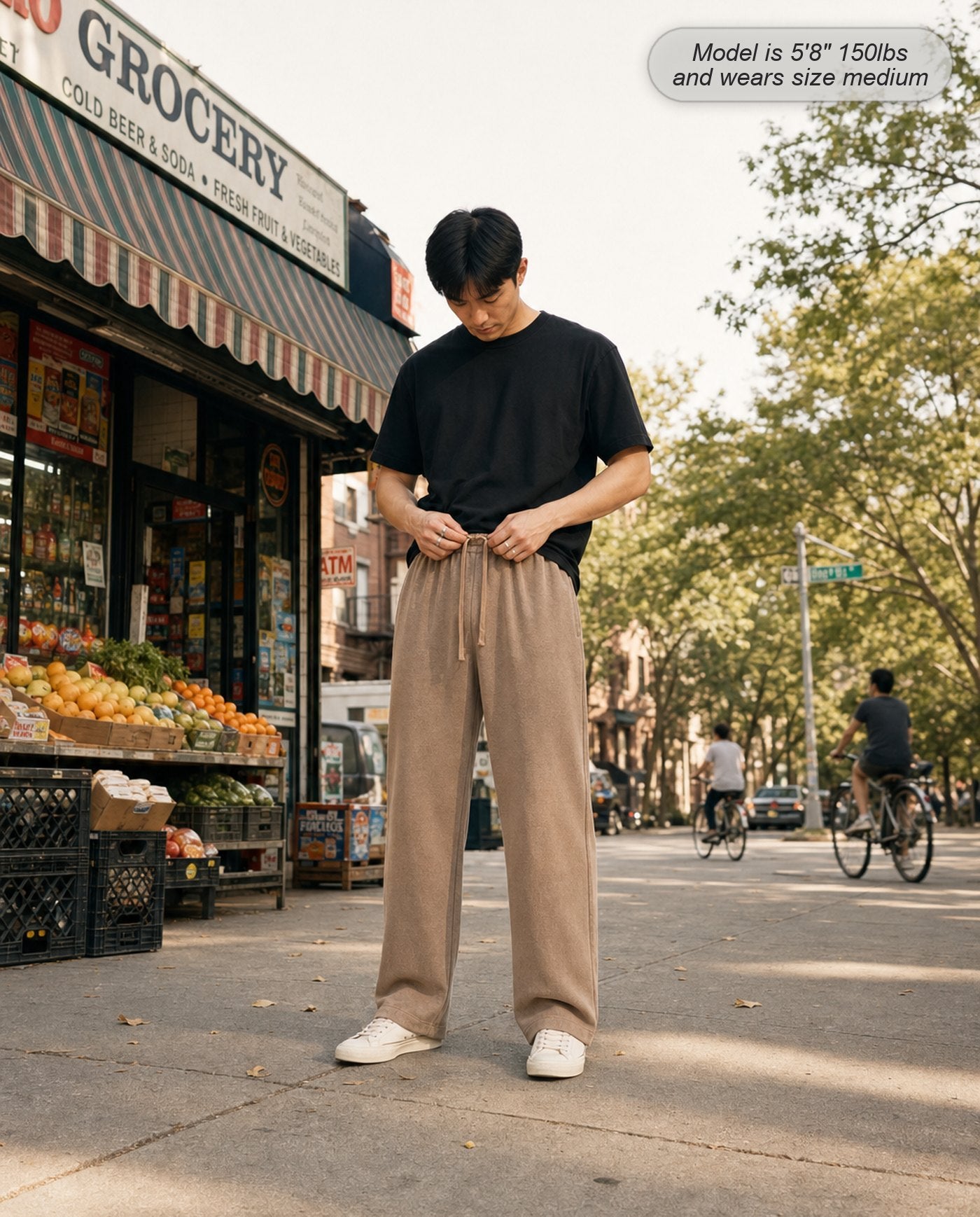 Man wearing Citadel sweatpants in washed camel outside a corner store
