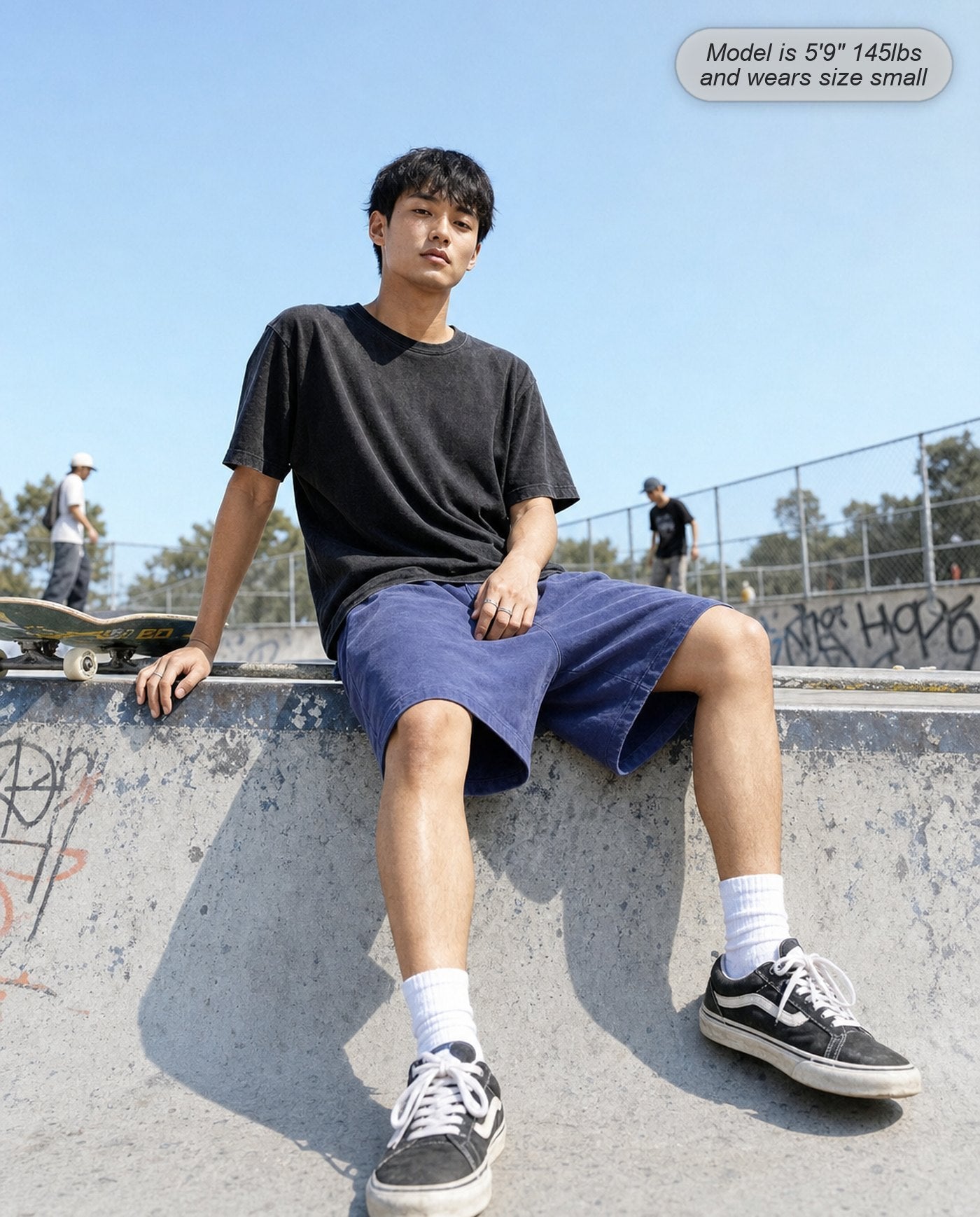 Man wearing Colossus shorts in royal blue at a skatepark