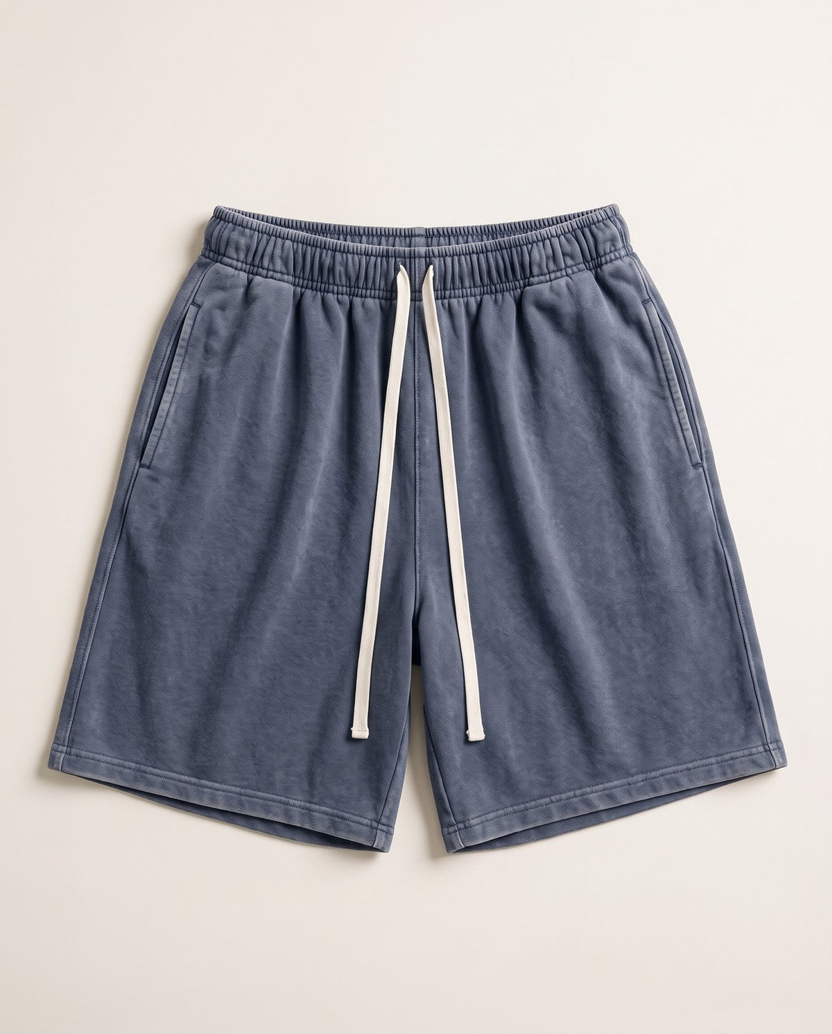 Colossus baggy acid wash shorts laid flat in washed navy
