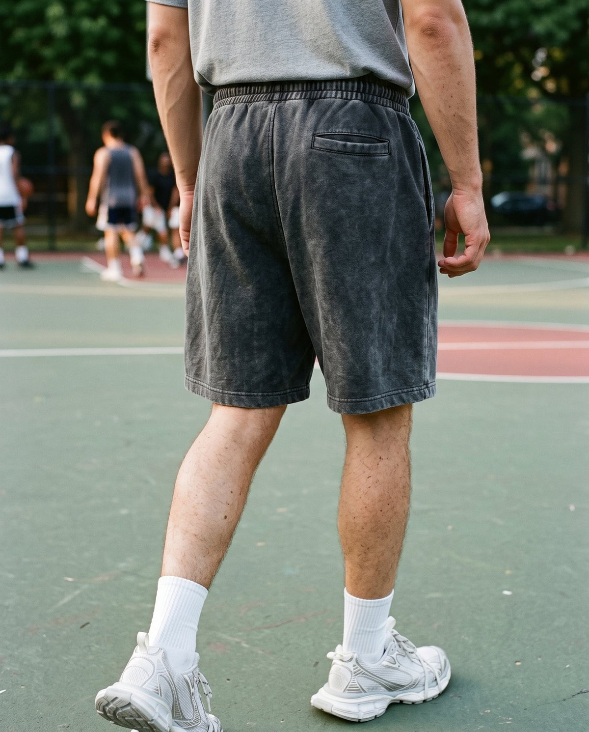 Rear view of the Colossus baggy shorts in washed black