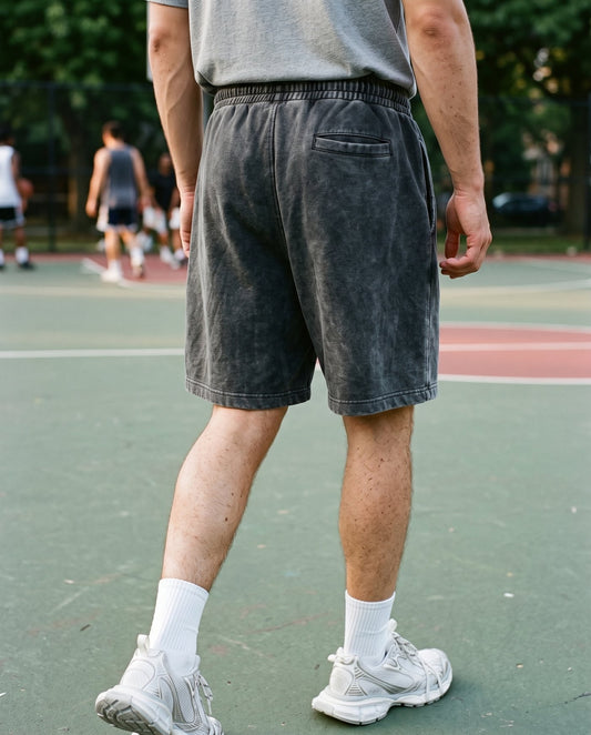 Rear view of the Colossus baggy shorts in washed black