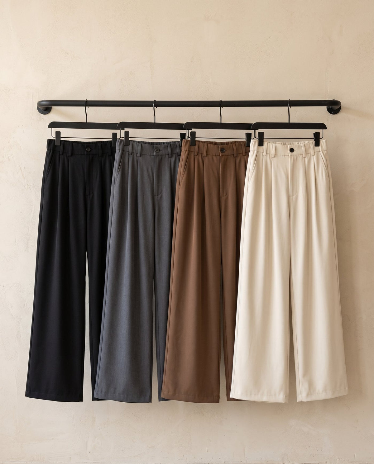 Envoy pleated wide leg trousers hung in all four colourways