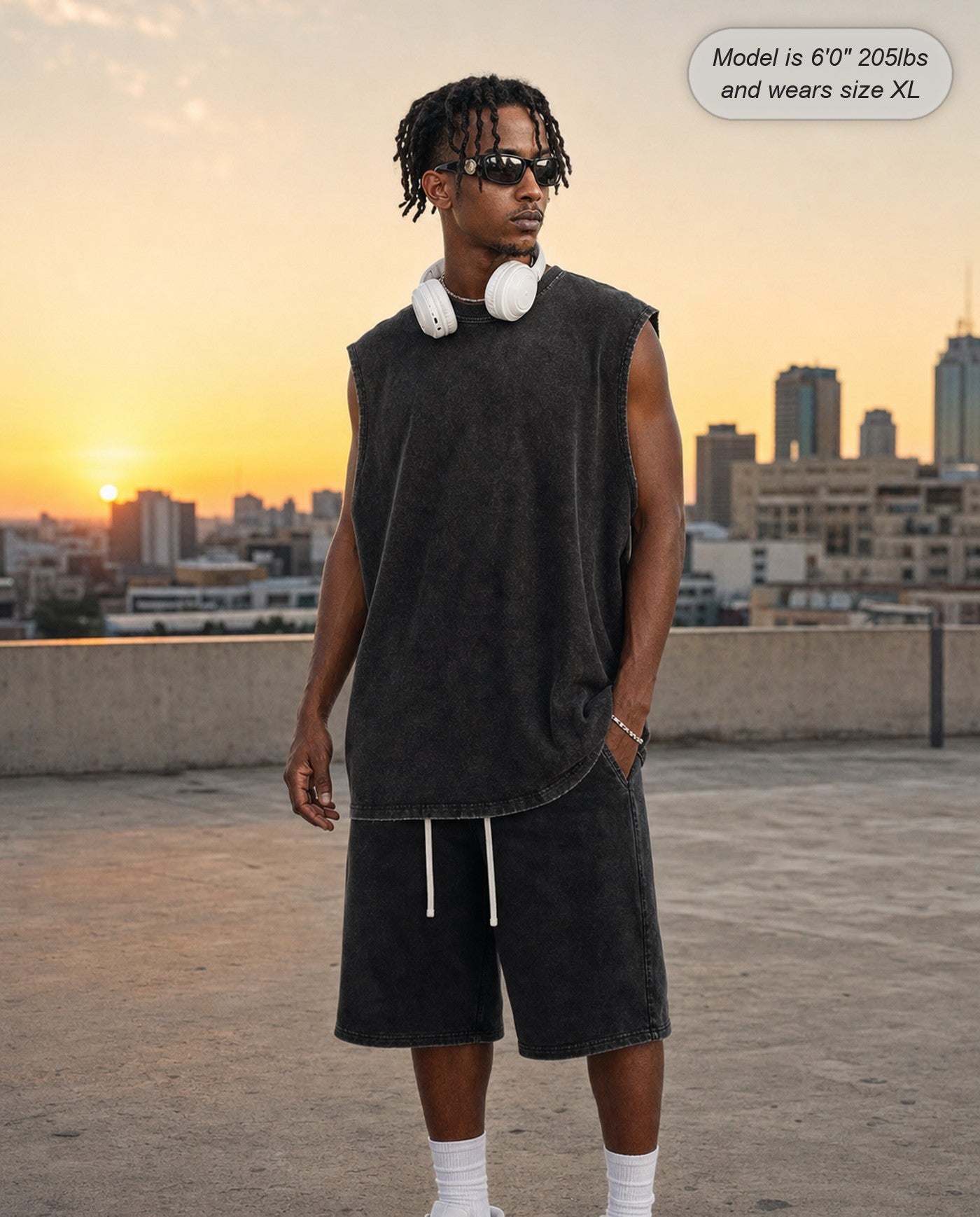 Man wearing the Ironclad acid wash tank in brown on a rooftop