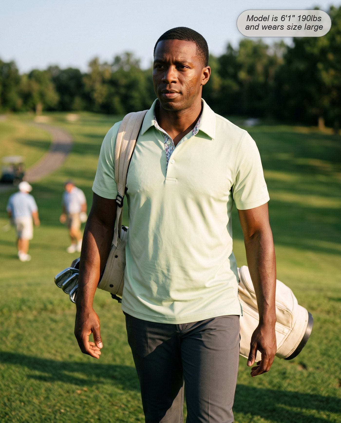 Man wearing the Meridian golf polo in pistachio walking the fairway