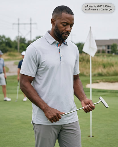 Man wearing the Meridian golf polo in silver on the putting green