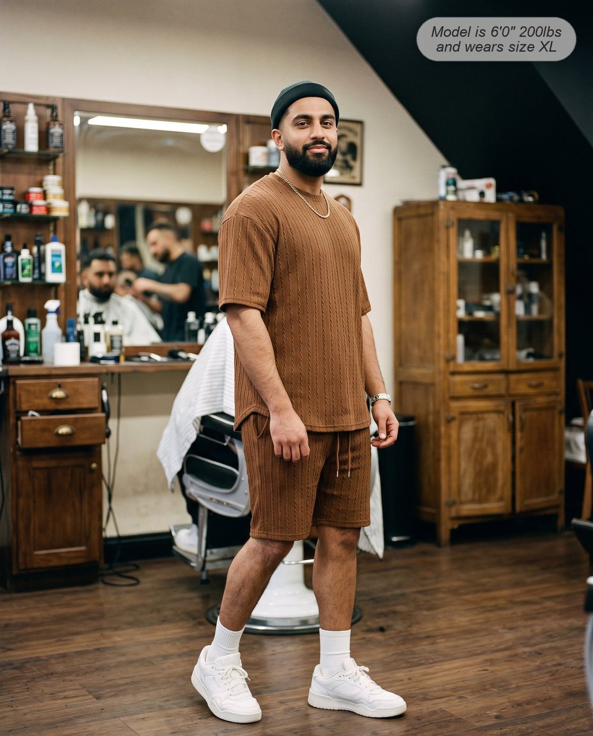 Man wearing the Monarch lounge short set in coffee in a barbershop